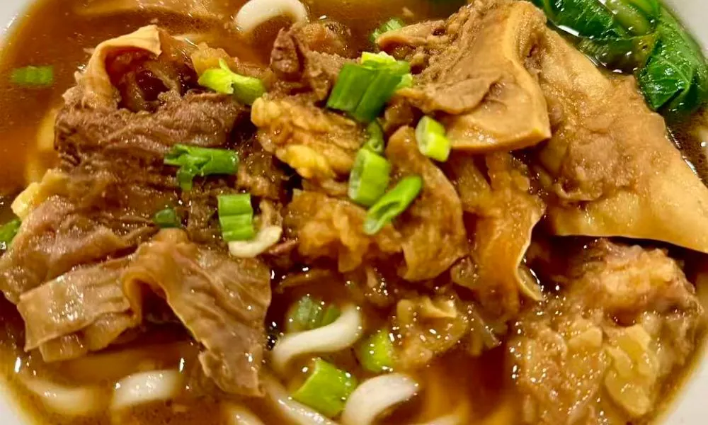 Rich soup with tender beef brisket, udon noodles, and bok choy at Hot Wok Cafe, a Chinese Restaurant in Greens West Windsor Township