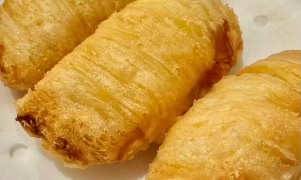 Flaky layered pastry roll with a crispy exterior at Hot Wok Cafe, a Chinese Restaurant in Greens West Windsor Township