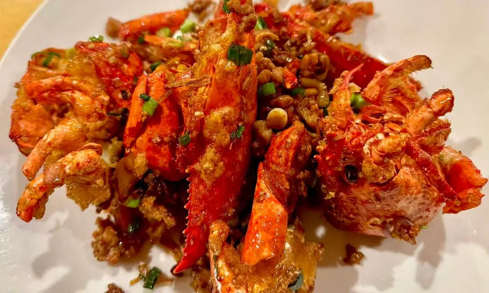 Succulent lobster stir-fried with fragrant minced garlic and scallions at Hot Wok Cafe, a Chinese Restaurant in Greens West Windsor Township